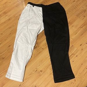 Half white and half black Hot Topic pants.